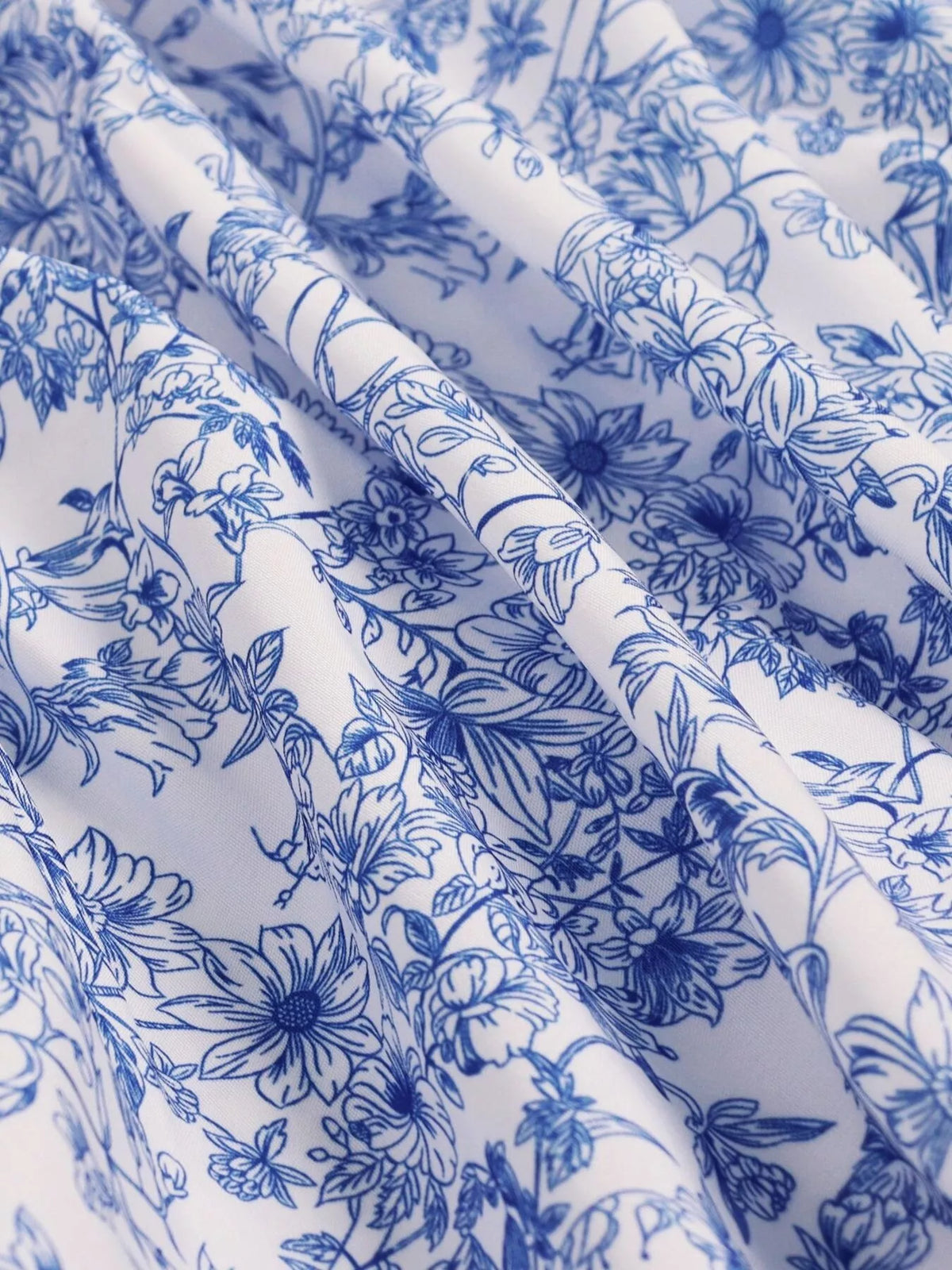 Blue floral halter neck ruffle hem summer dress, full length view