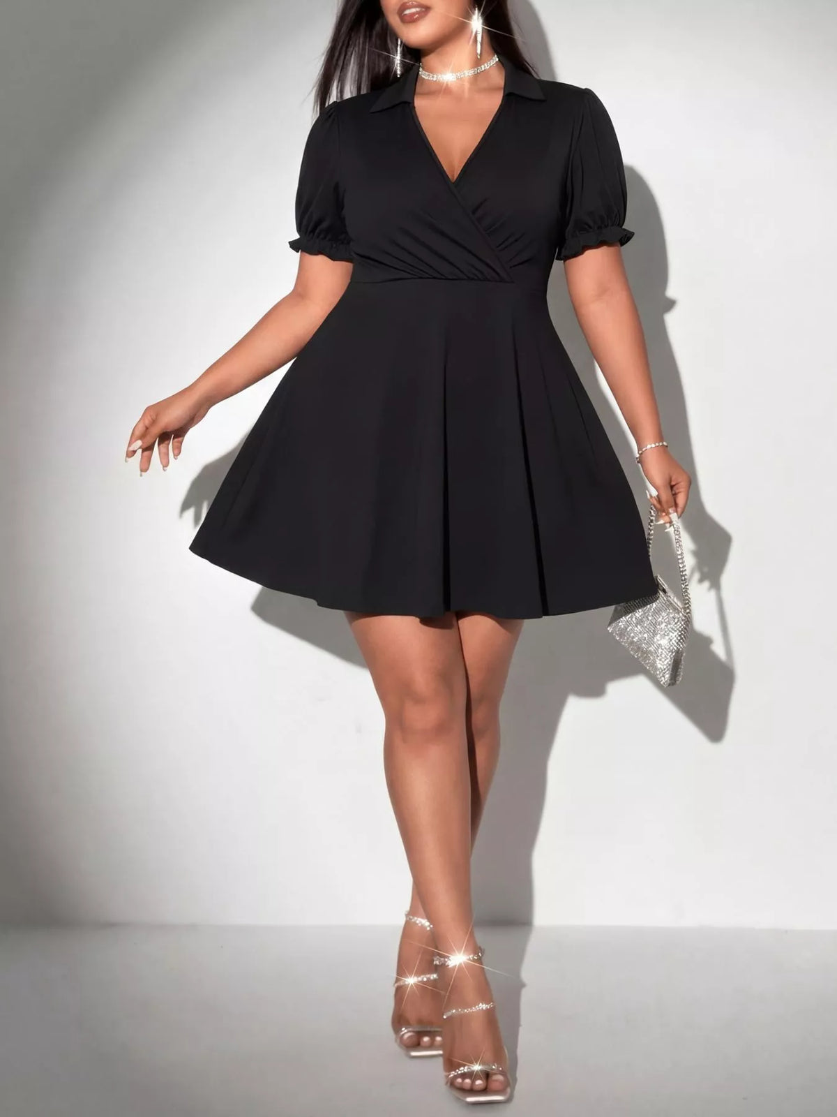 Plus size black surplice short sleeve mini dress front view