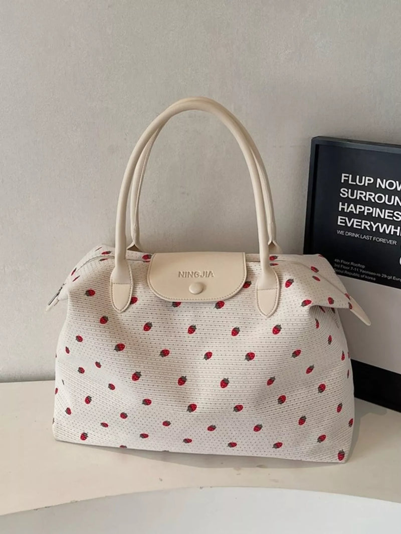 White strawberry print travel duffel bag front view