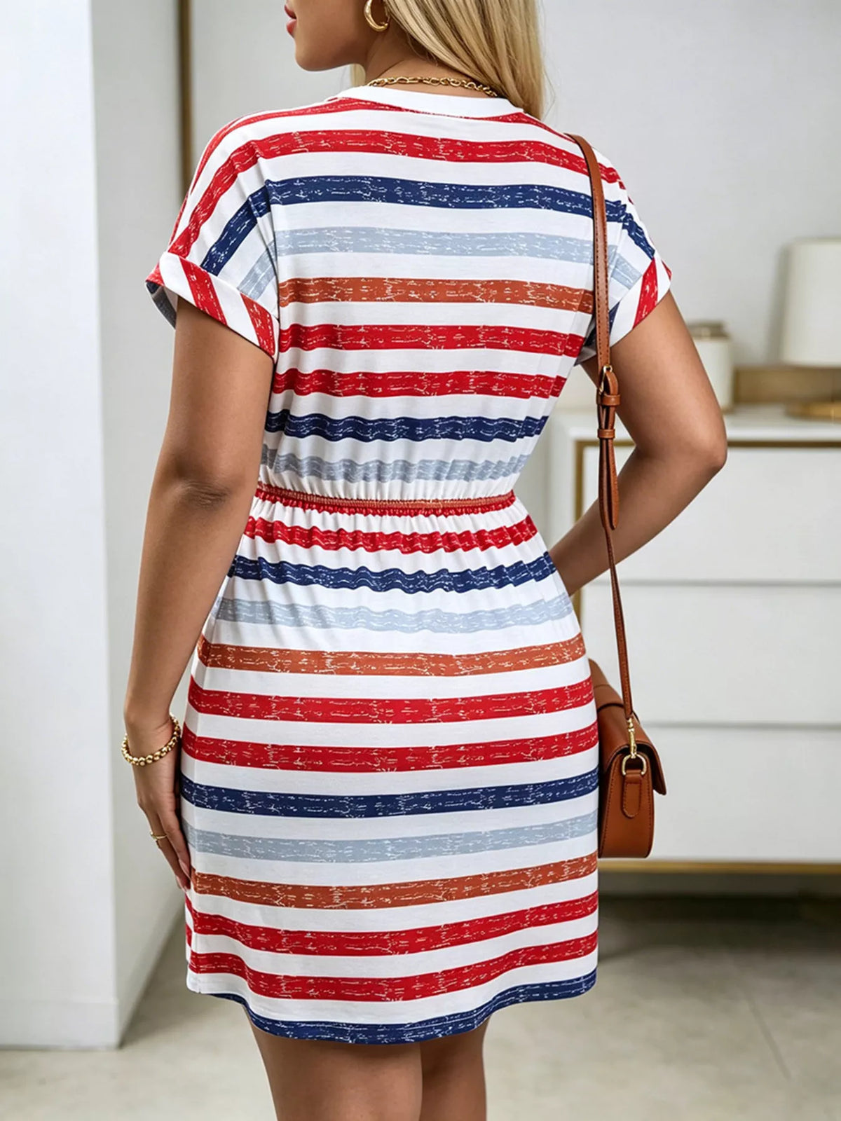 Striped casual dress side view showing the full skirt