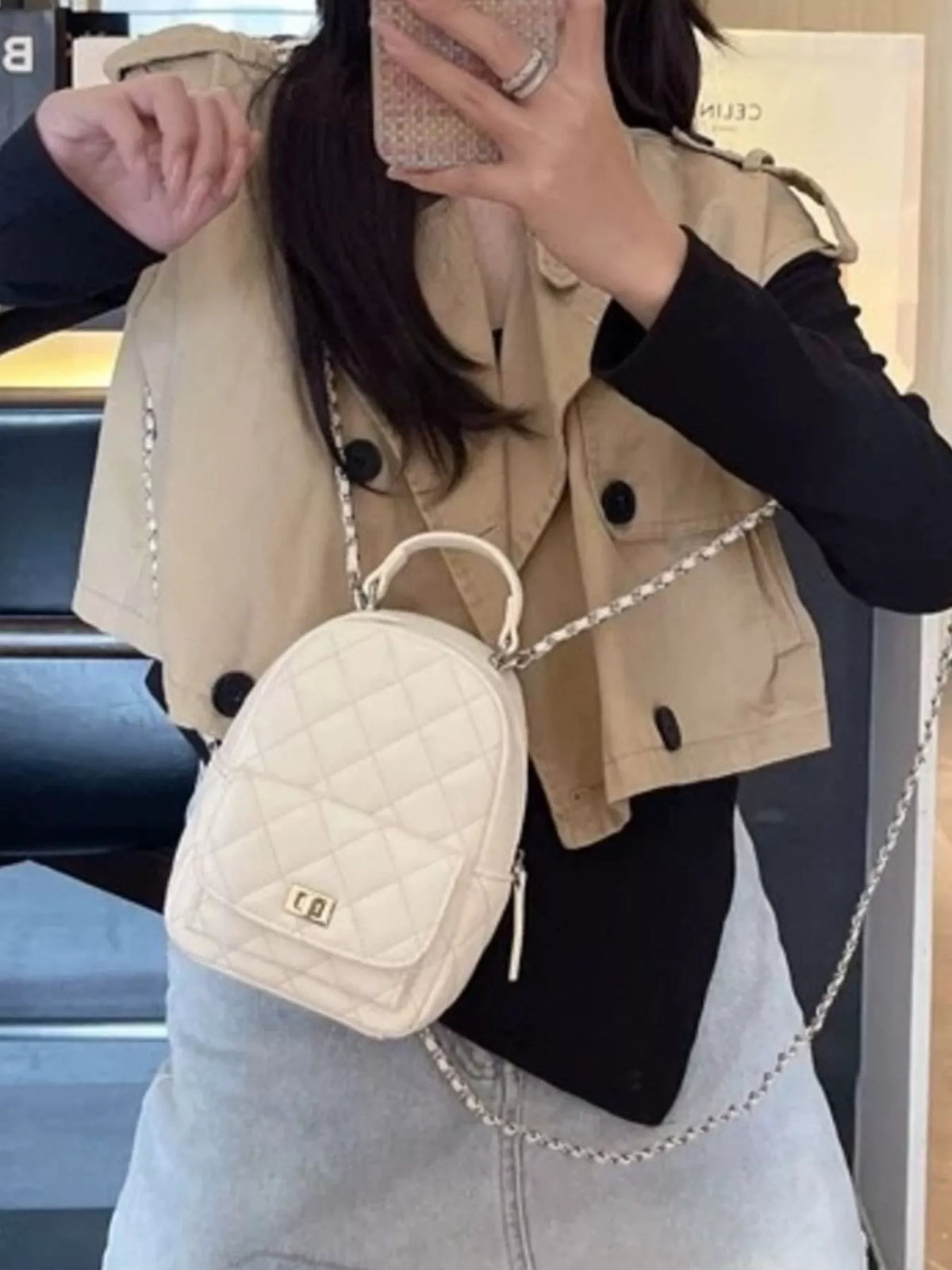 Quilted mini backpack top zip detail