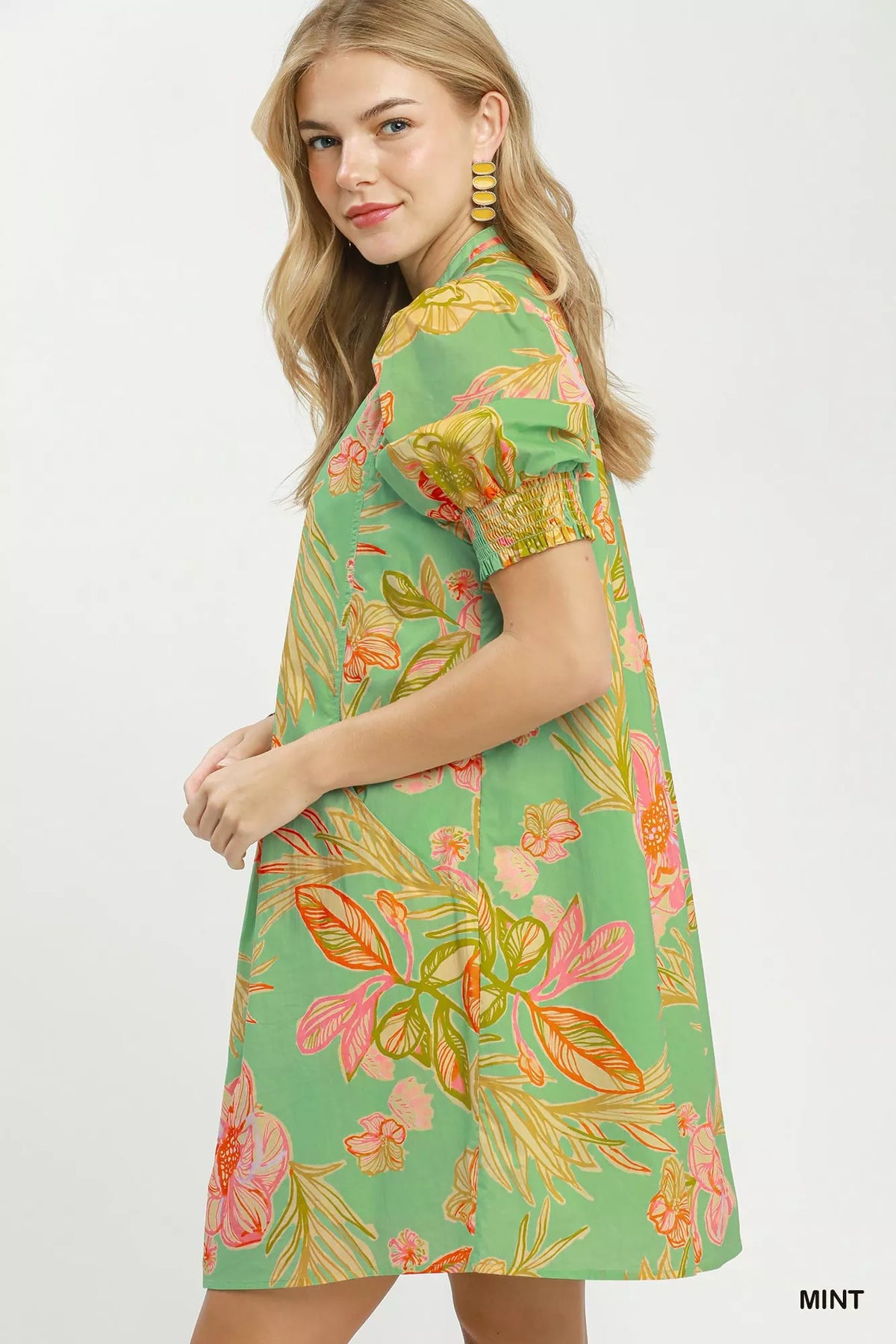 Mint botanical print boho dress with smocked cuffs front view