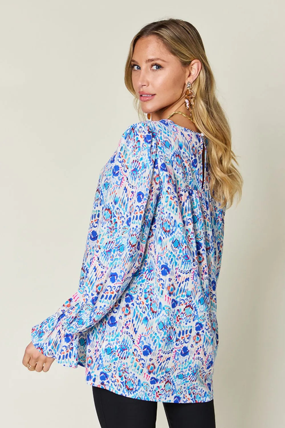 Back view of printed long sleeve blouse