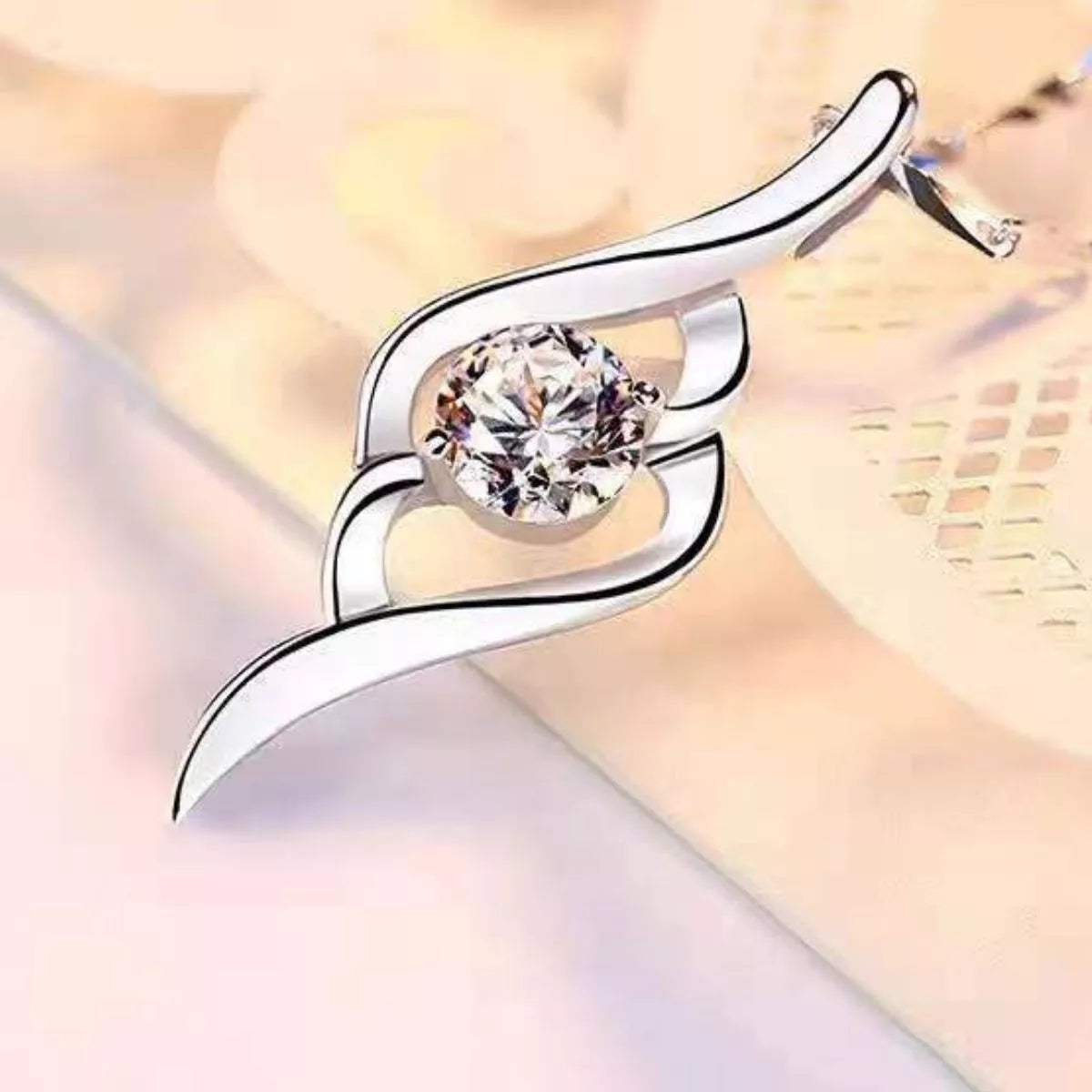 Close up of the moissanite pendant and silver setting