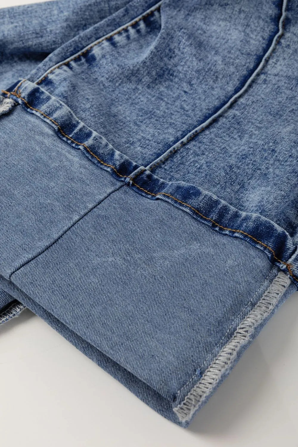 Denim texture on cuffed jeans