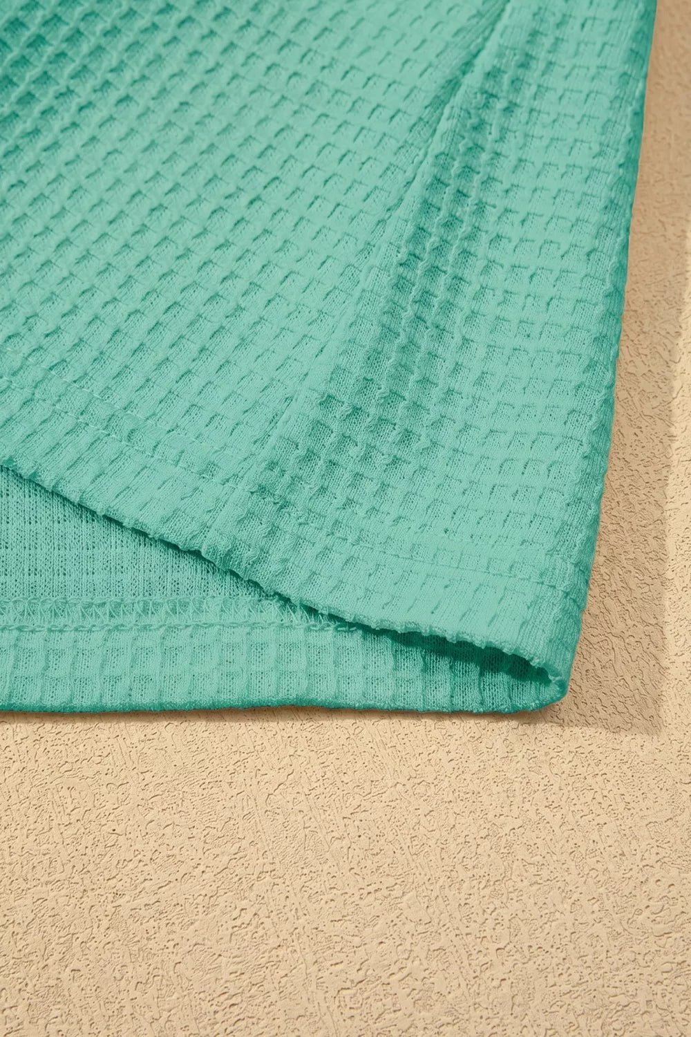 Turquoise waffle knit v neck top with lace trim front view