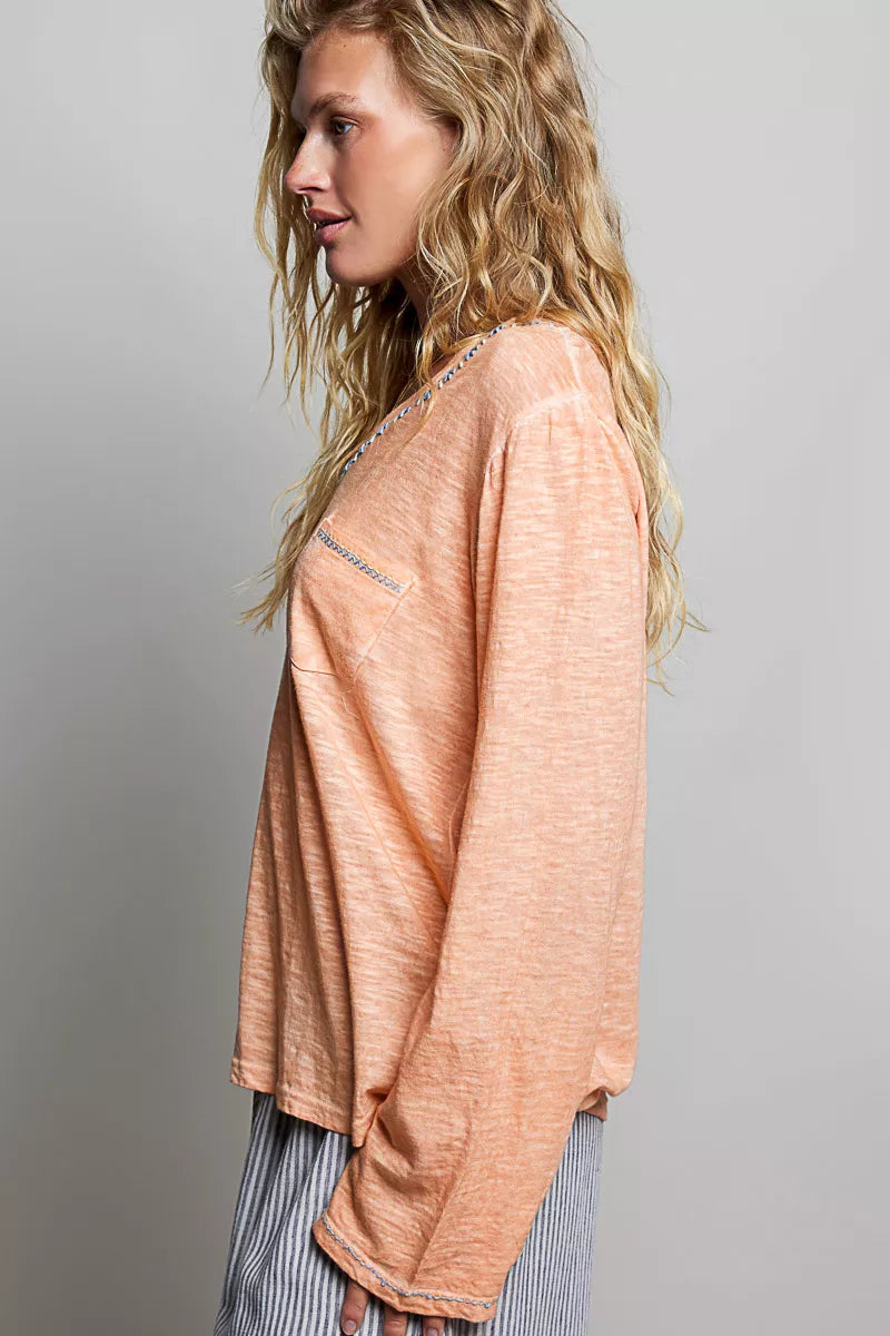 Coral peach contrast stitch v neck long sleeve knit top side view