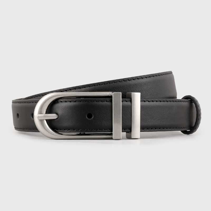 Leather belt with silver buckle coiled flat