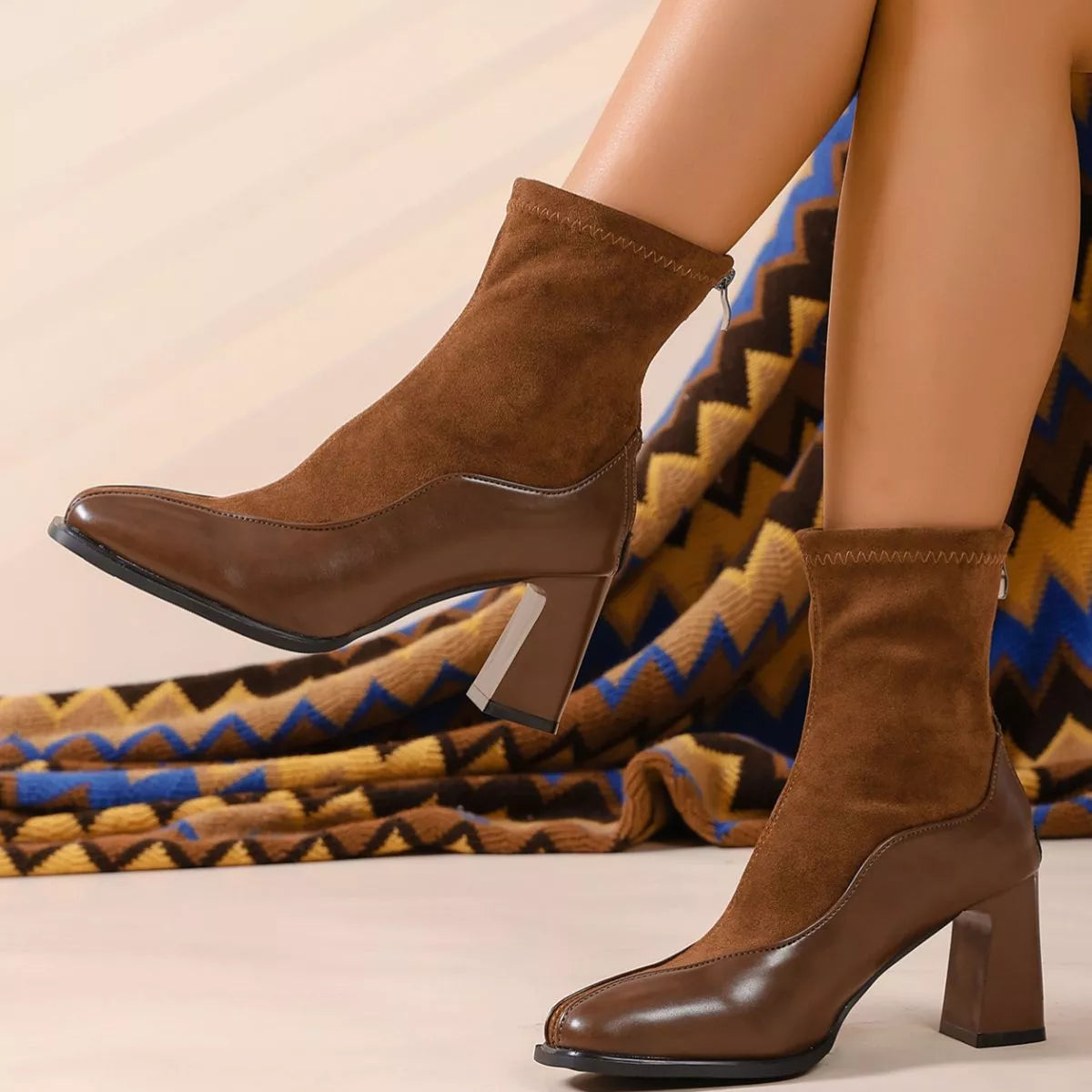 Square toe block heel boots pair styled together