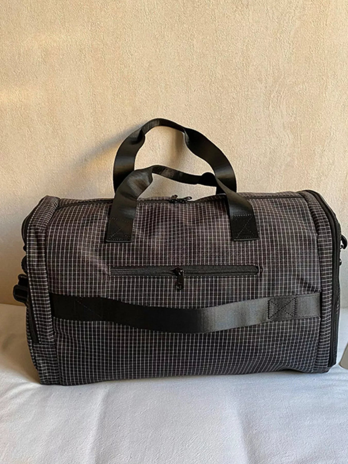 Black duffel bag front pocket detail
