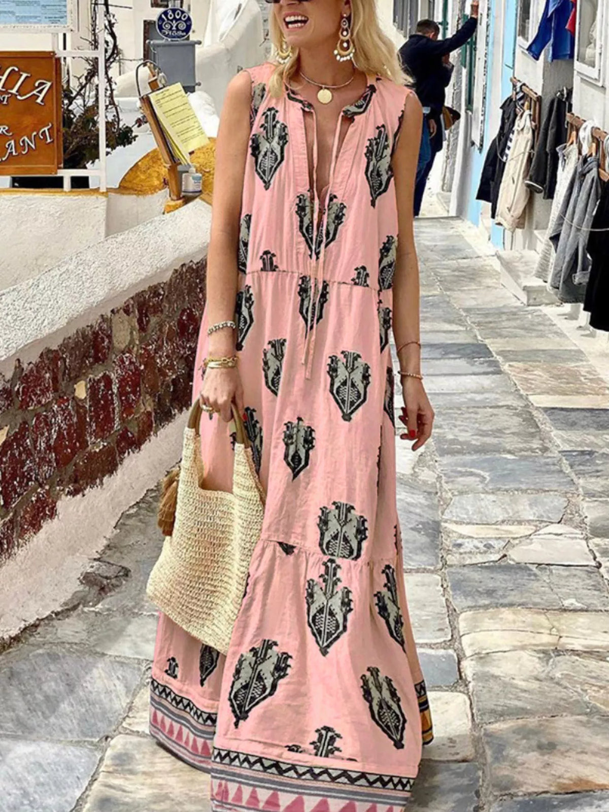 Printed sleeveless tiered maxi dress, skirt and hem detail