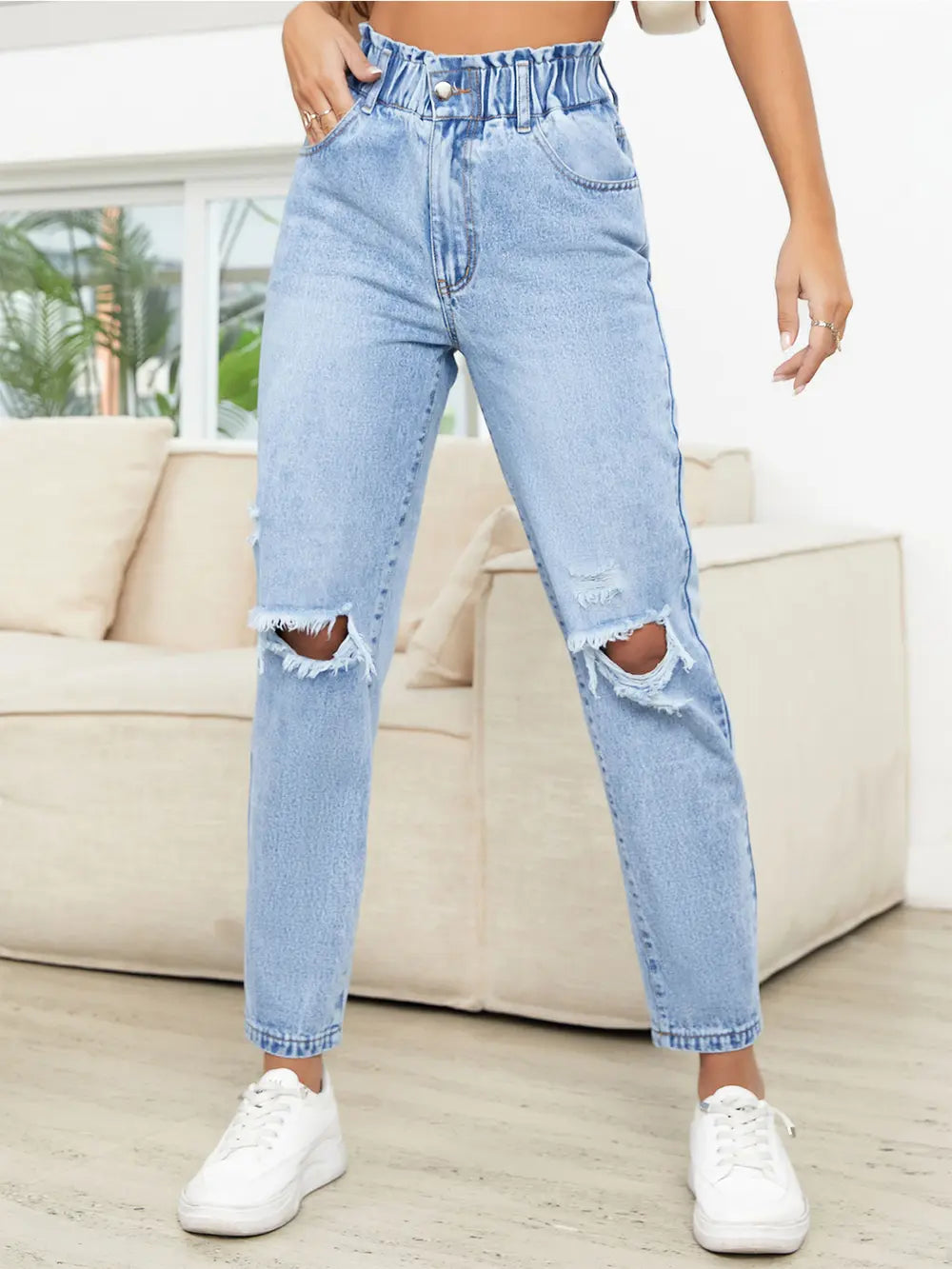 Side view of high waist distressed jeans