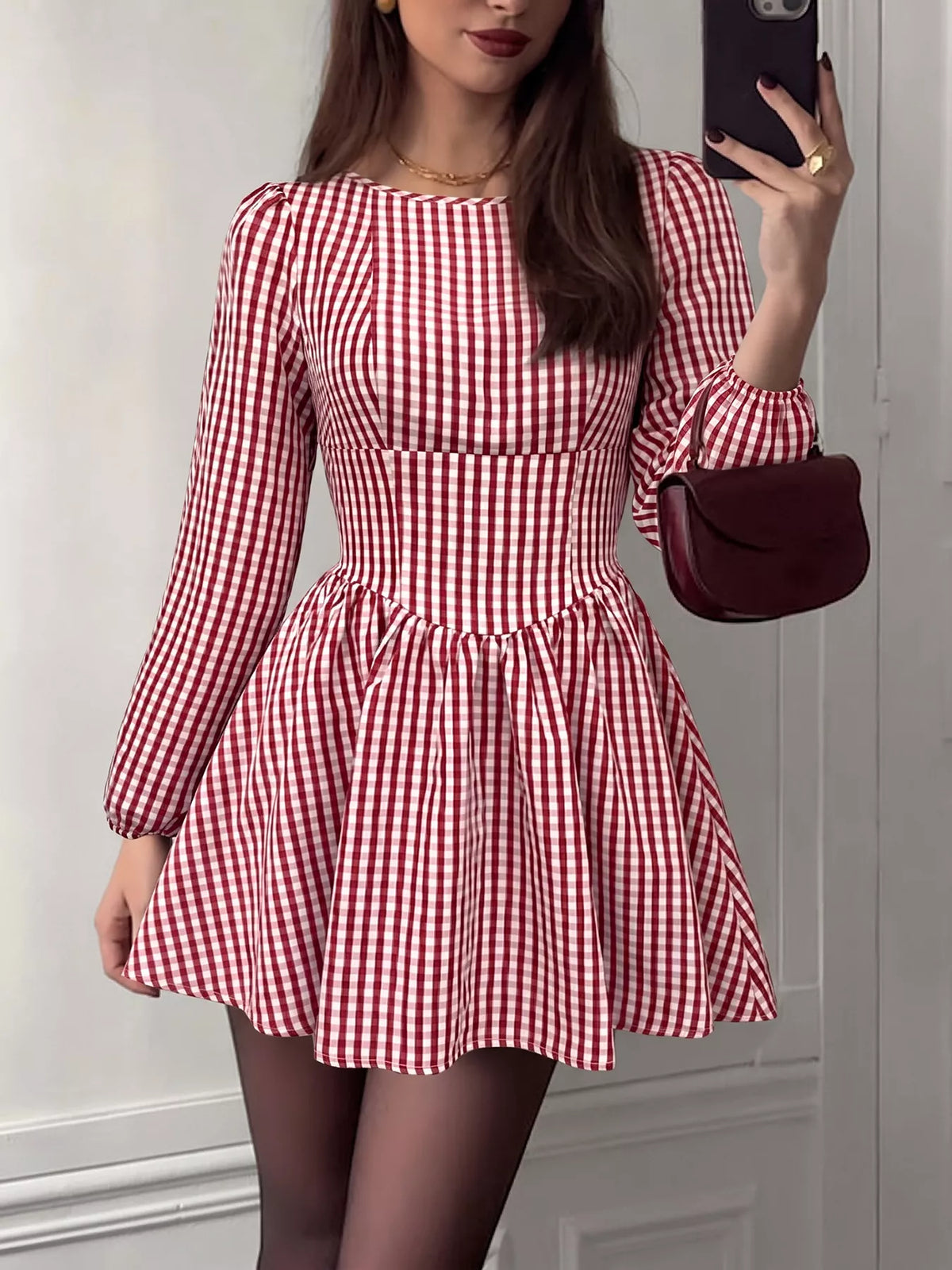 Red plaid dress shown from the back to display the open back