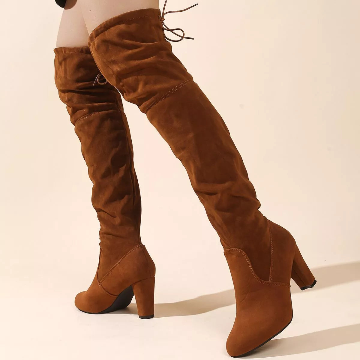 Over the knee high heel suede boots close up detail