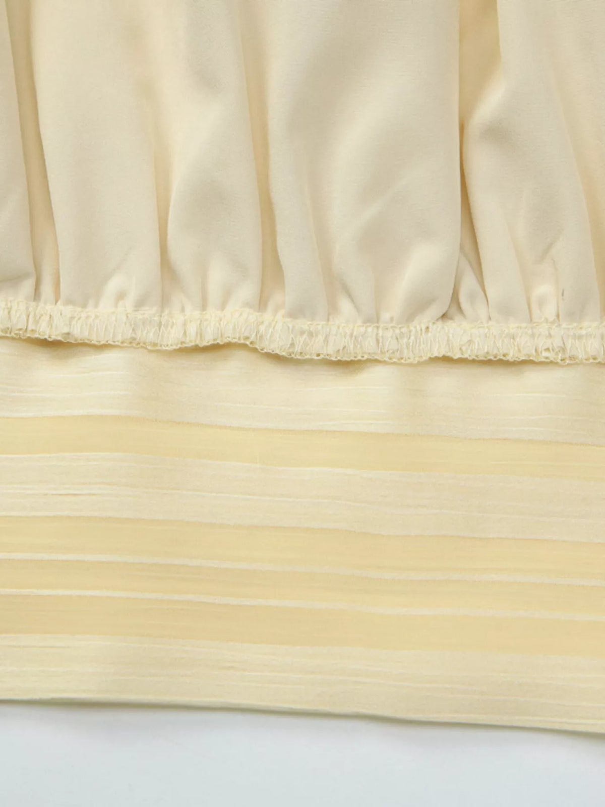 Stripe pattern detail across the cami bodice
