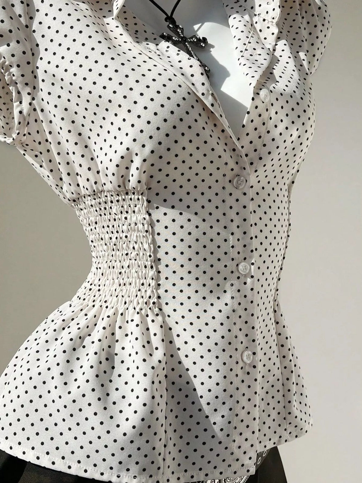 Cap sleeve detail on the polka dot blouse