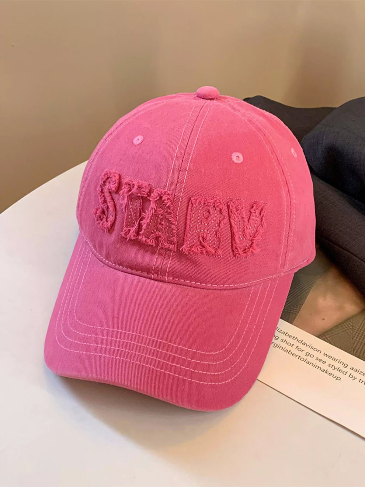 Rose red frayed letter cap side view