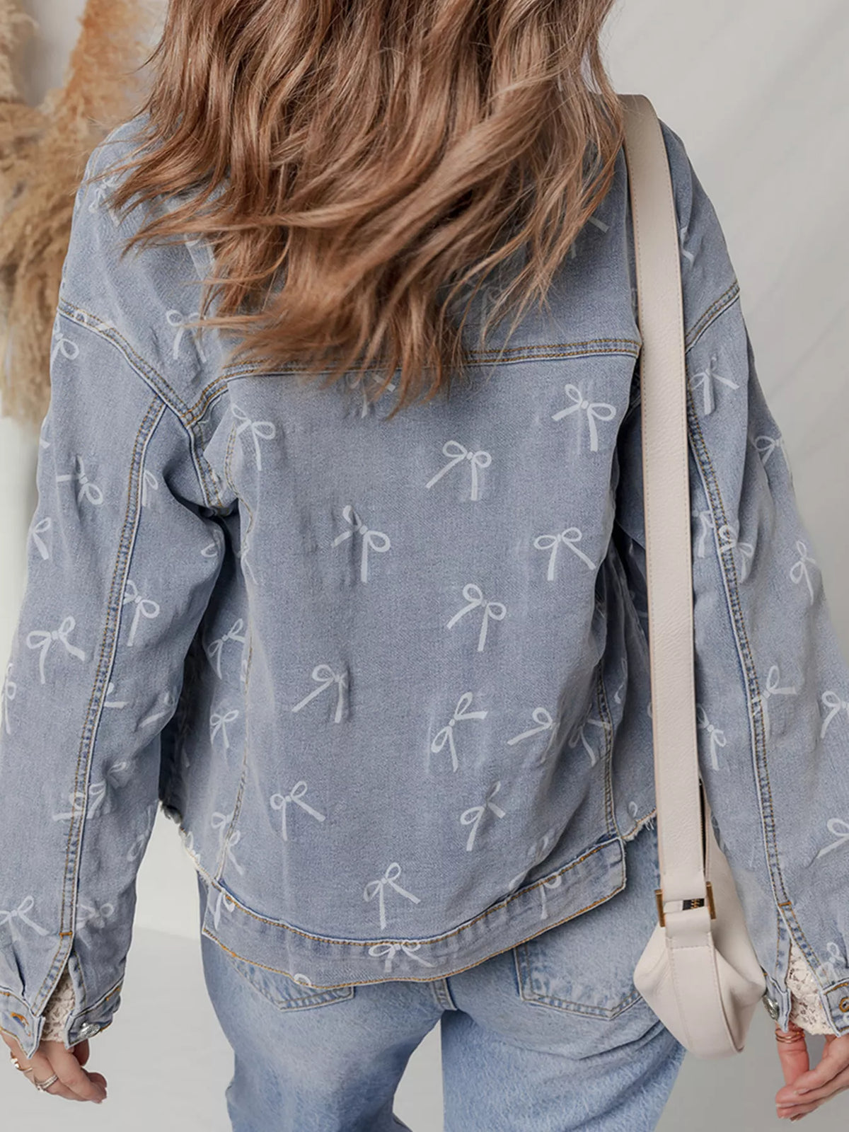 Bow Print Raw Hem Denim Jacket in Light Wash back view