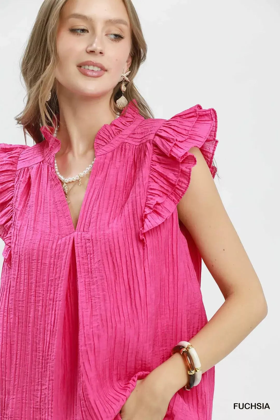 Umgee ruffle sleeve split V neck top in fuchsia close up detail