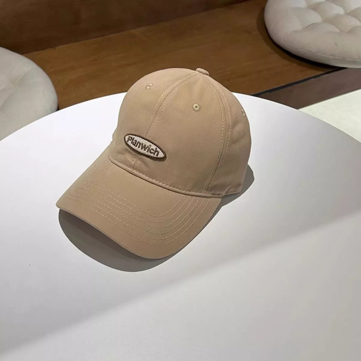 Burgundy embroidered baseball cap on a model