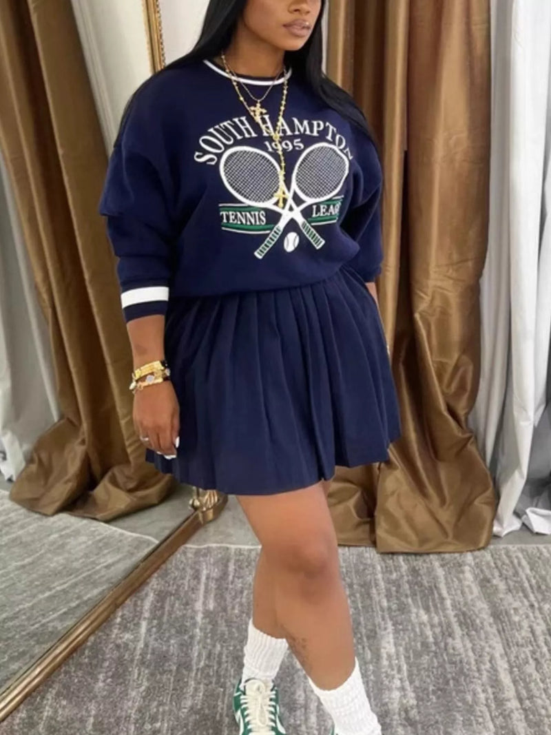 Navy blue graphic sweatshirt and pleated skirt two piece set front view