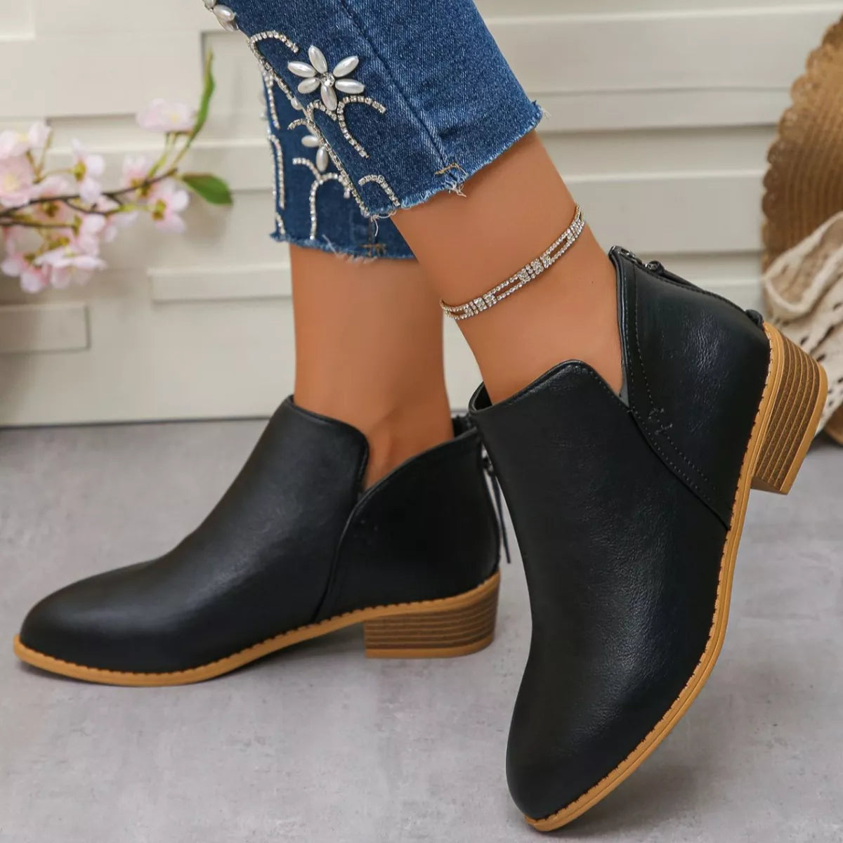 Point toe block heel ankle boots profile shot