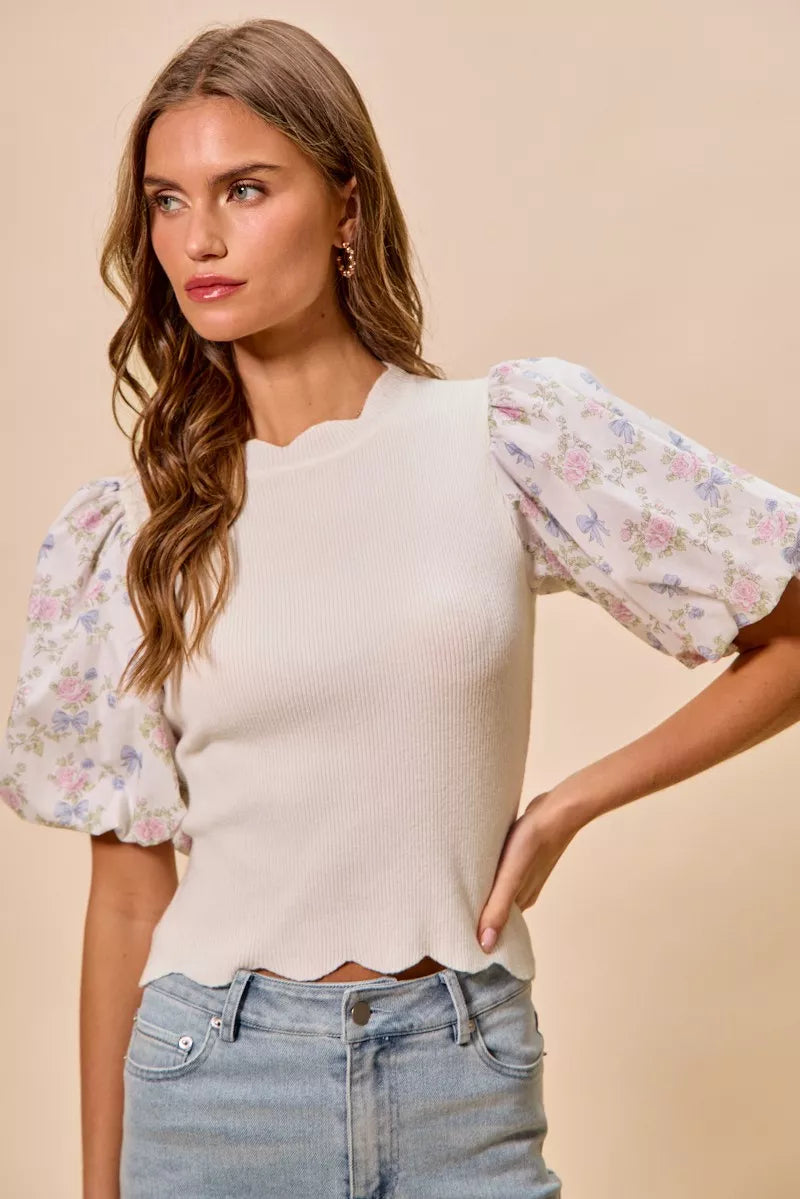 Floral sweater top with scalloped hem detail