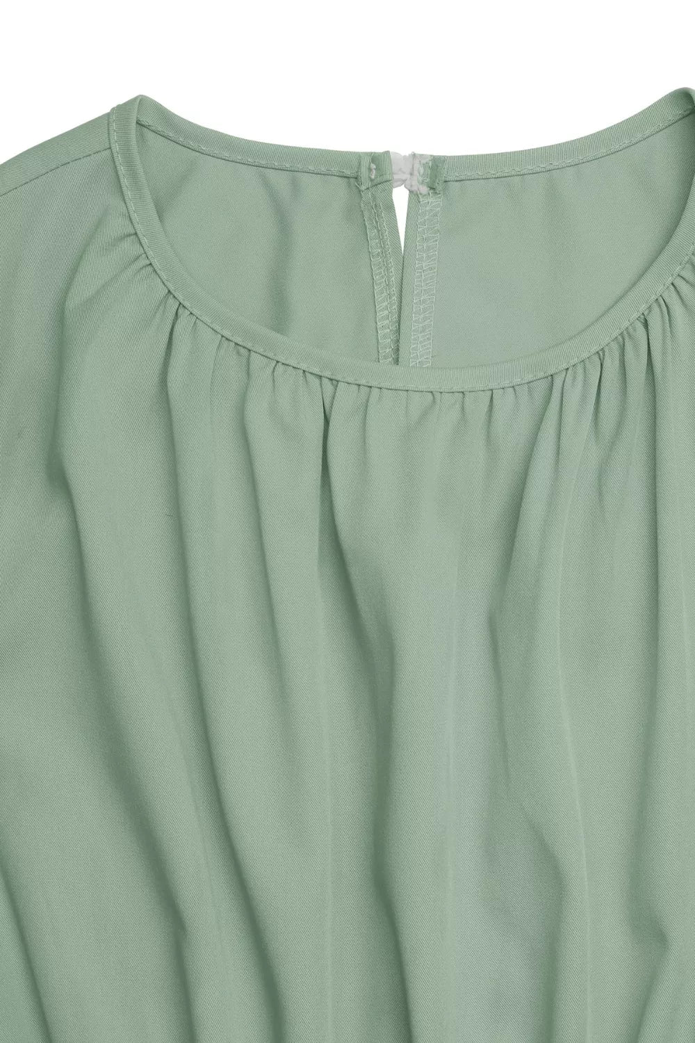 Sage green sleeveless dress fabric detail