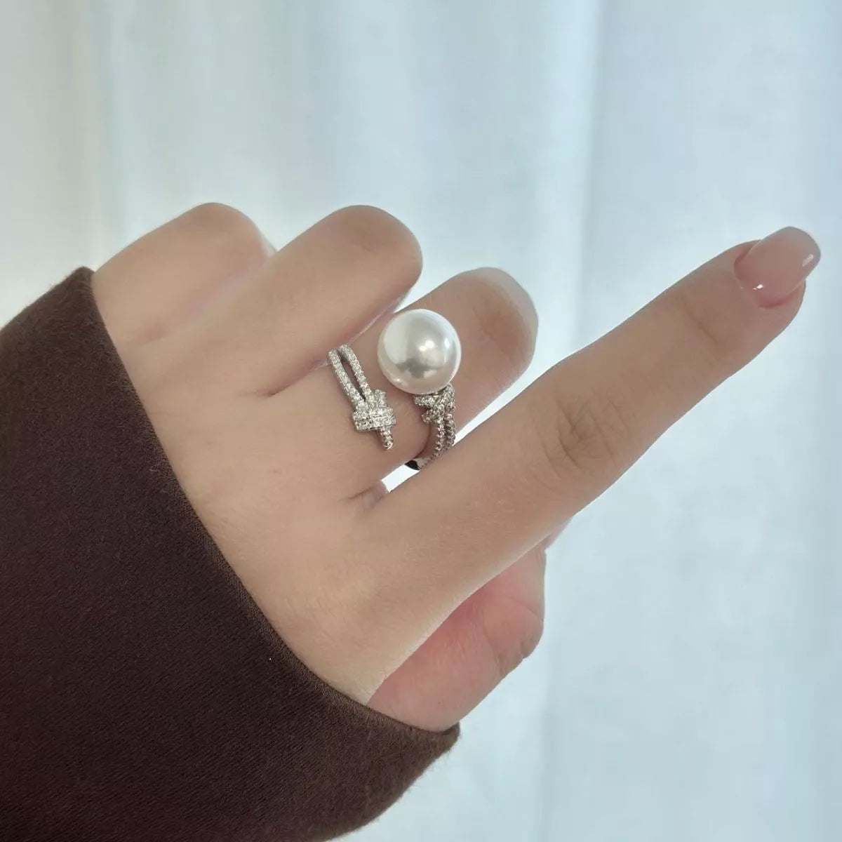 pearl and zircon bypass ring in sterling silver front view