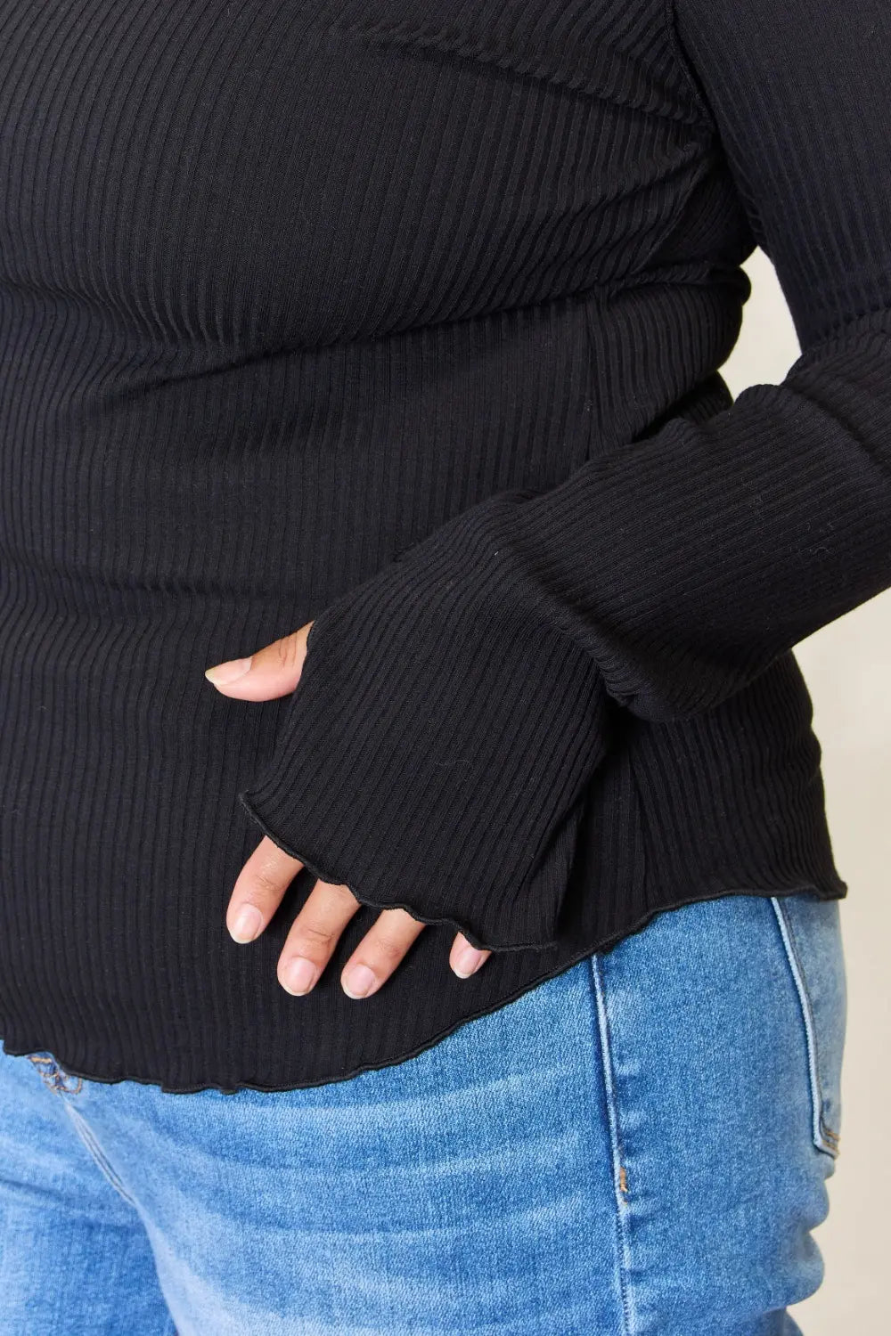 Long sleeve cuff detail on the black top