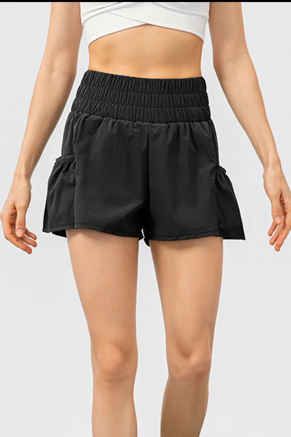 Elastic waist pocketed active shorts styling detail
