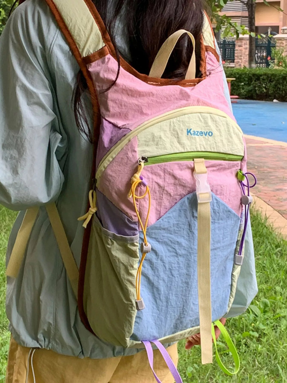 Pastel blue color block backpack zip and hardware detail