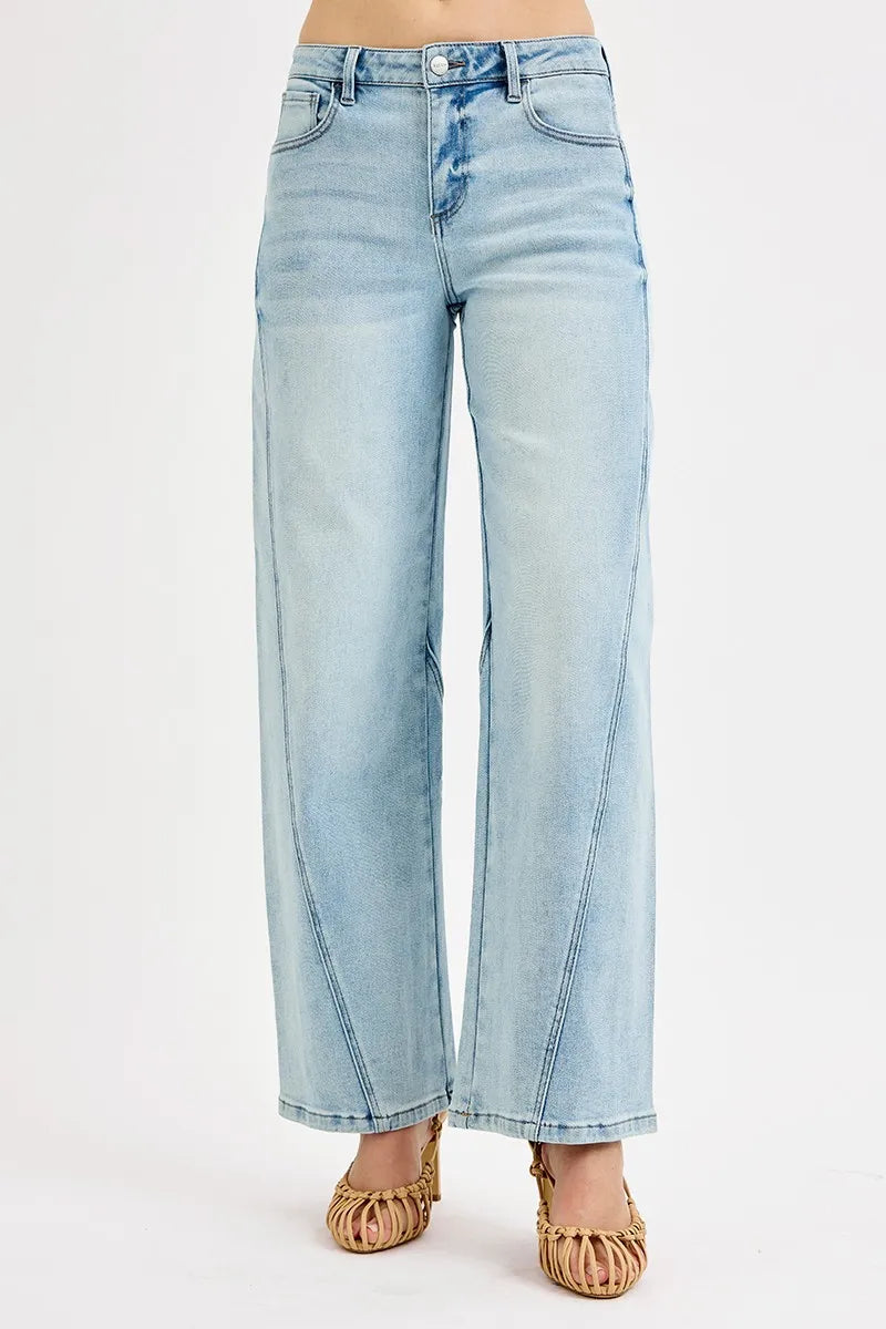 Light wash barrel jeans side profile showing rounded leg