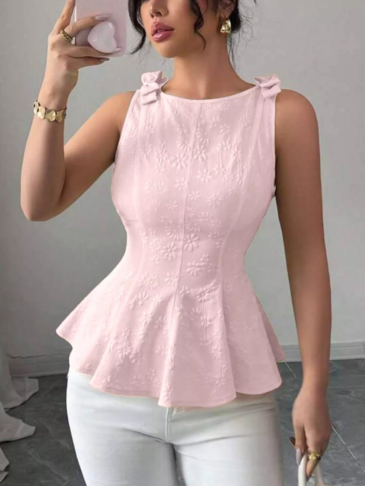 Bow shoulder peplum tank top close up view