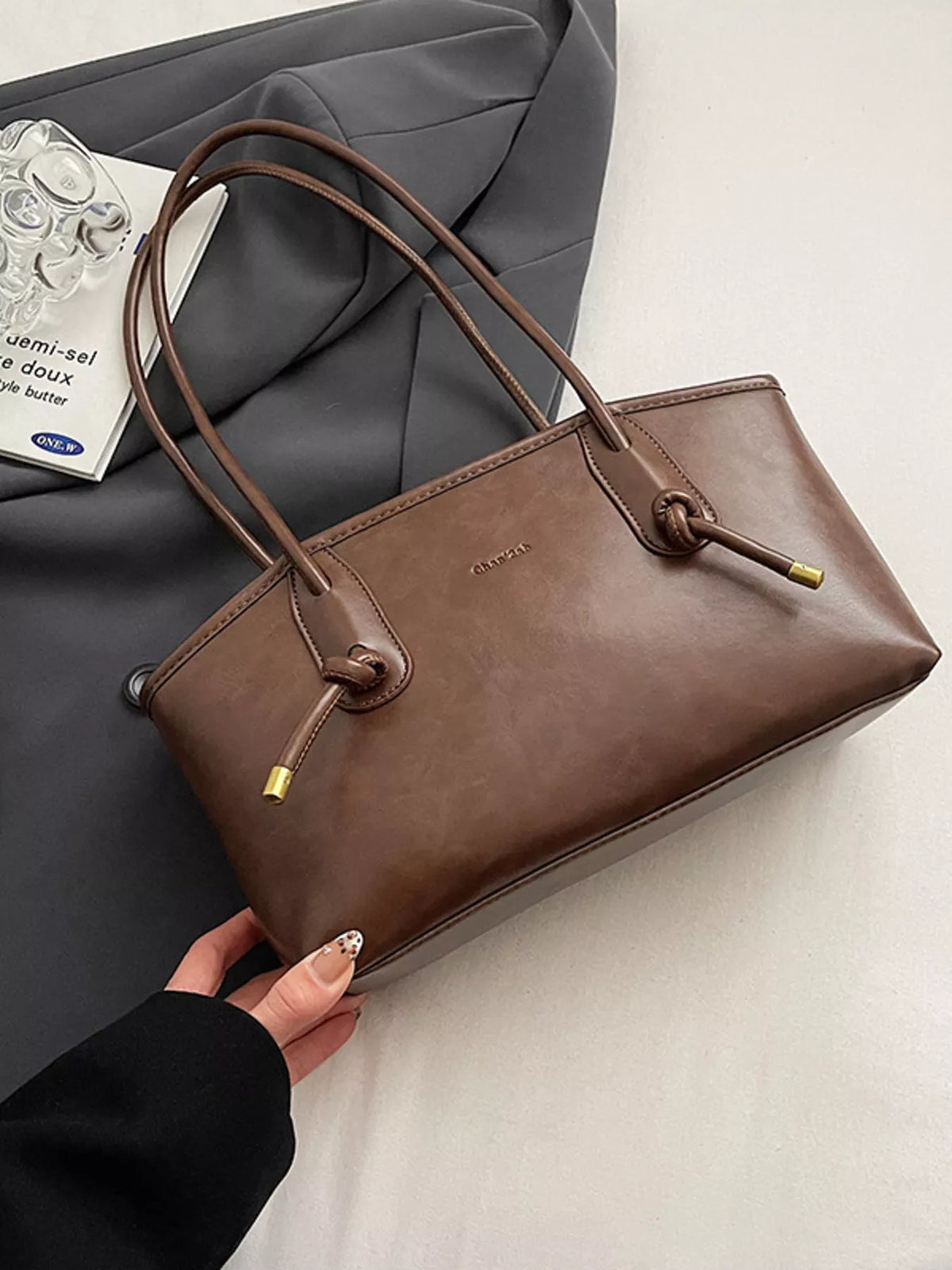 Leather shoulder bag flap detail