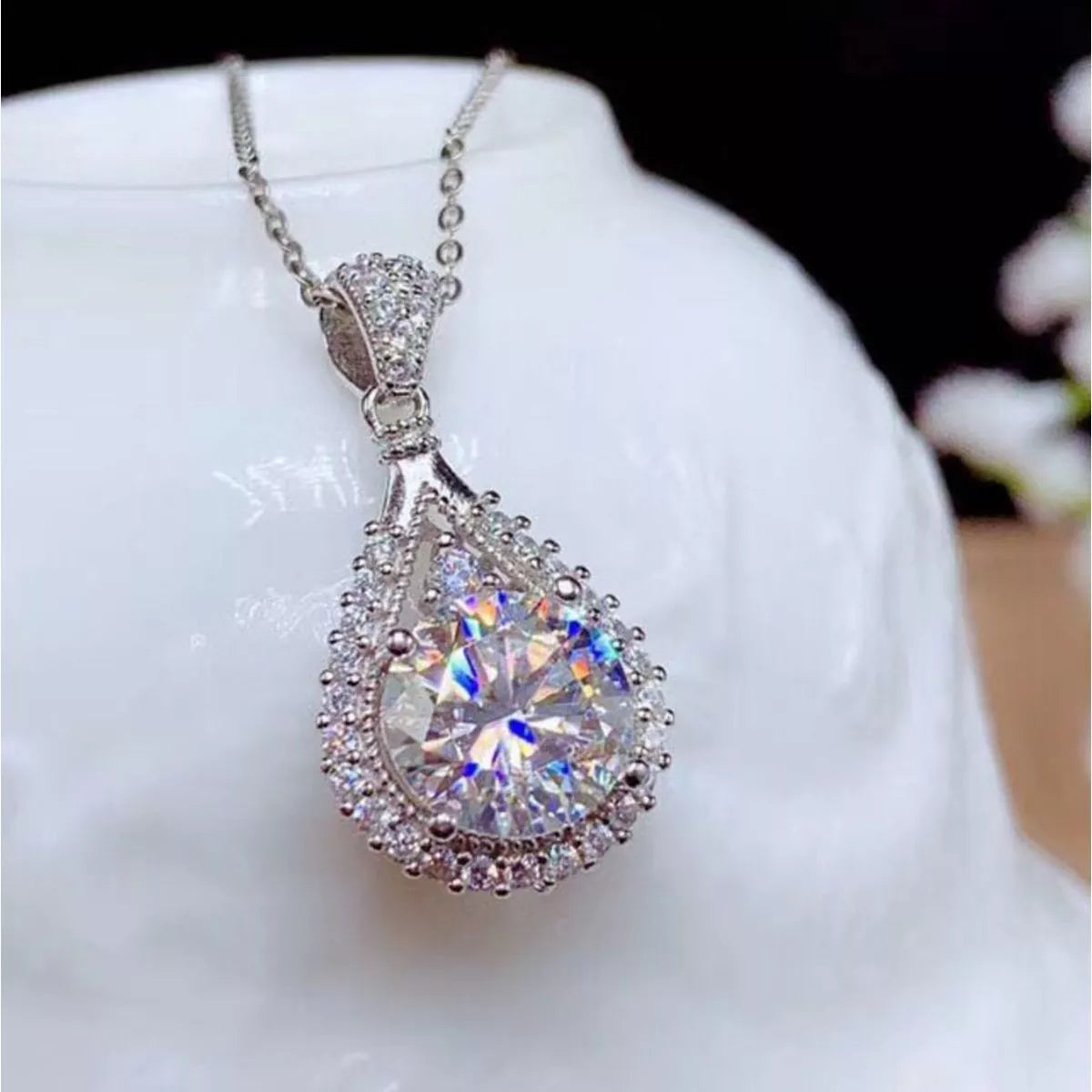 Moissanite pendant catching the light