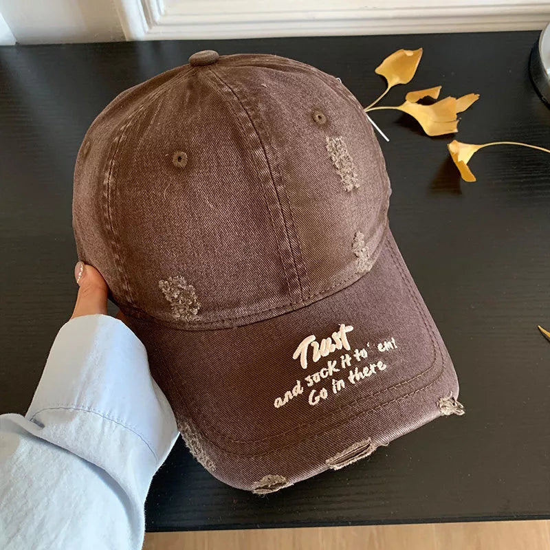 Back view of distressed cap showing closure