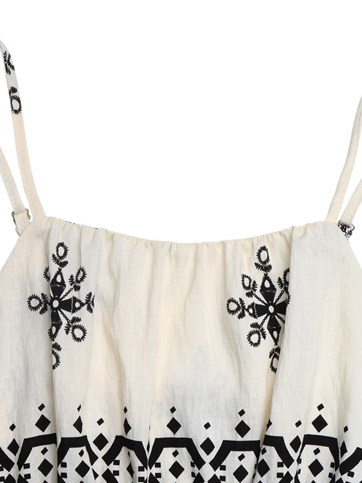 Three quarter view of the beige printed jumpsuit