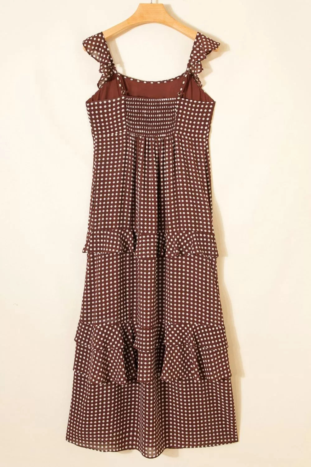 Caramel polka dot backless tiered maxi dress, seated styling view