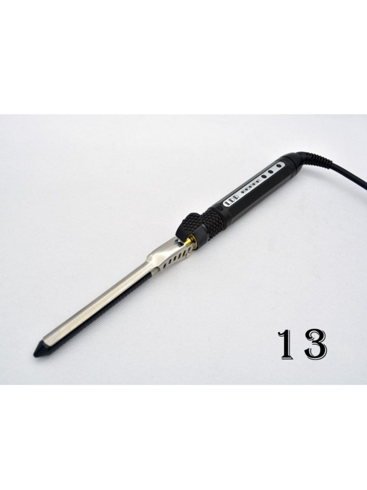 Curling iron with heat resistant tip