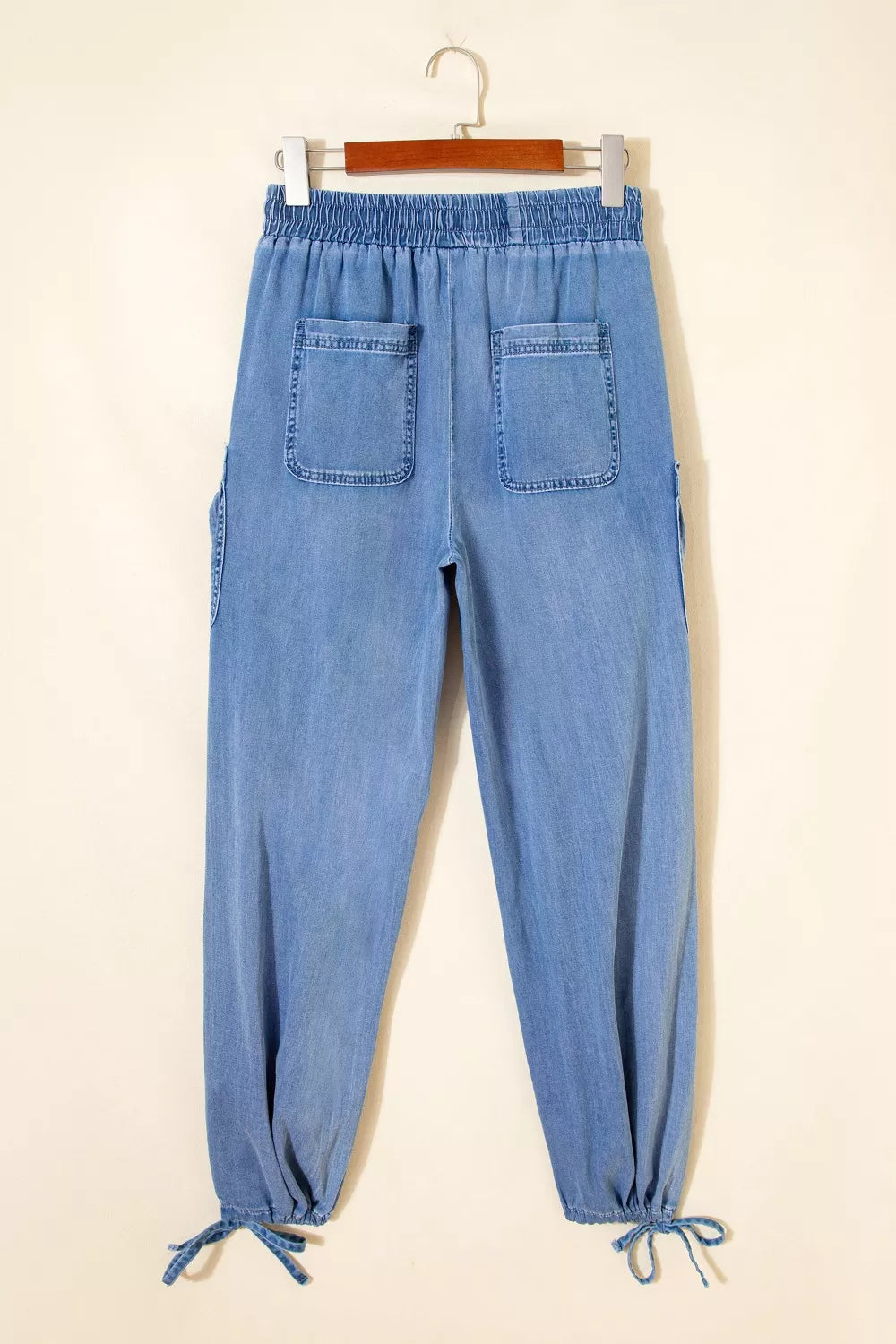 Elastic drawstring waist detail on denim
