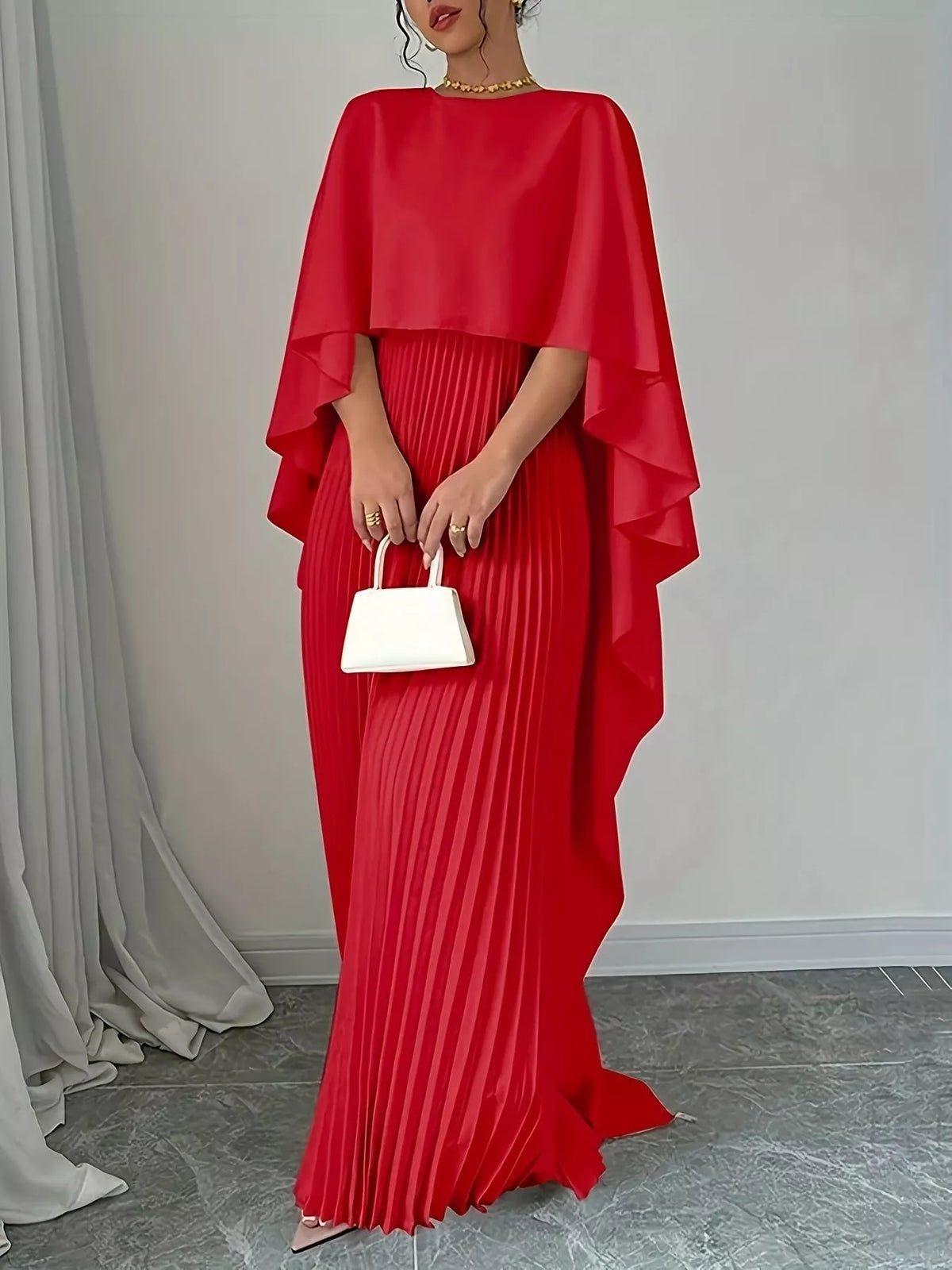 cape sleeve pleated maxi dress walking pose