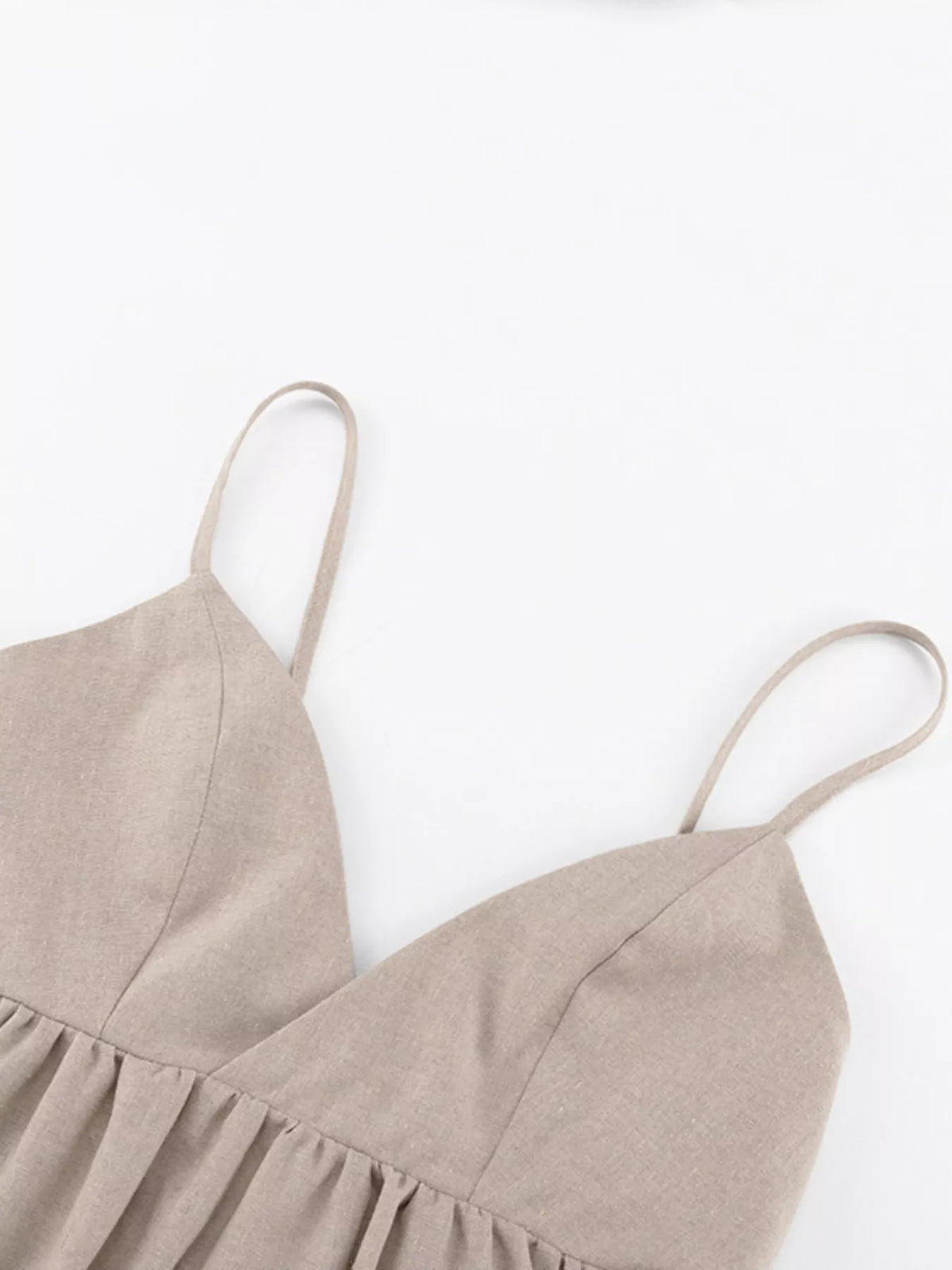 Backless mini dress styled with flat sandals