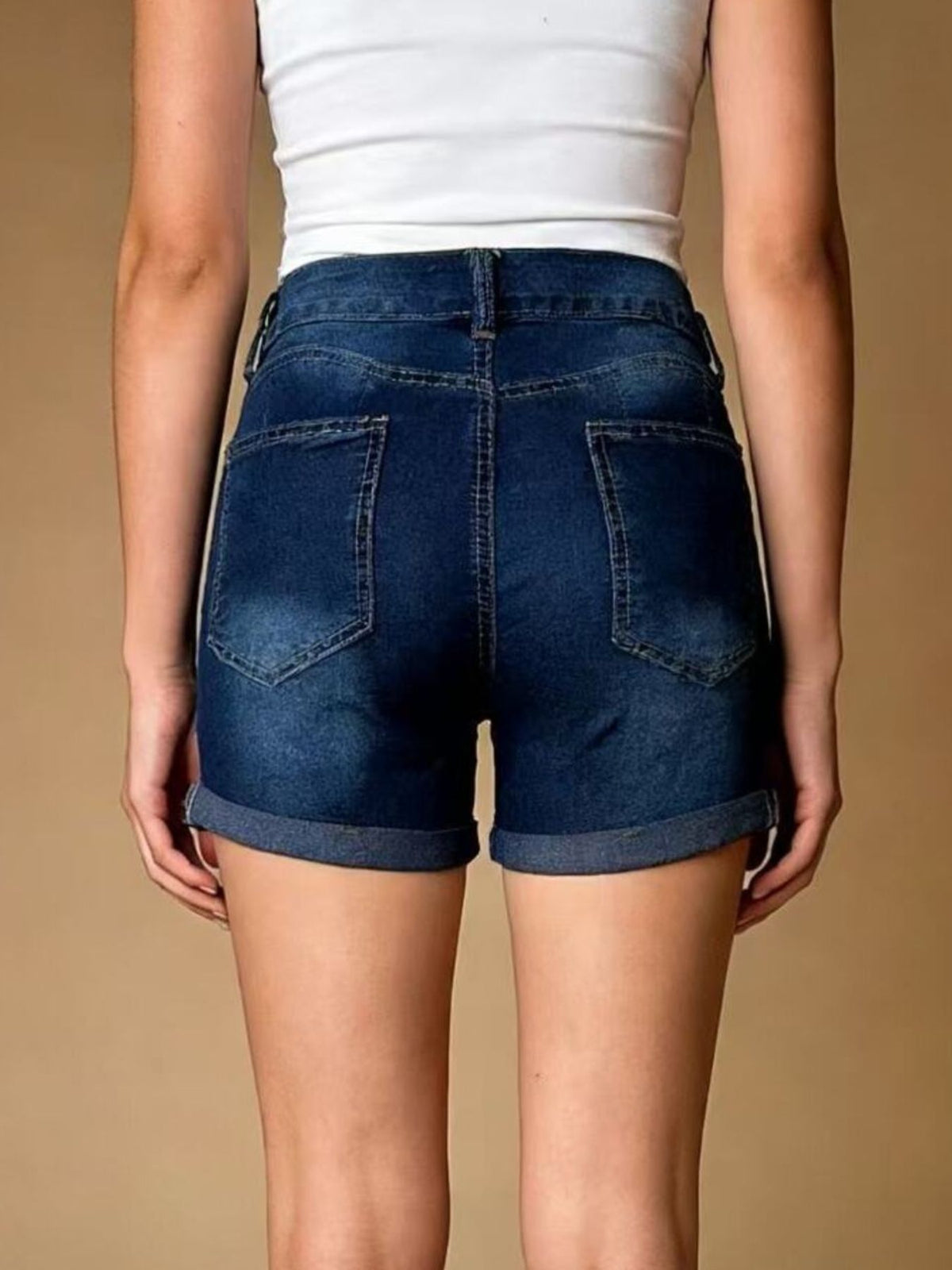 Denim shorts waistband and button detail