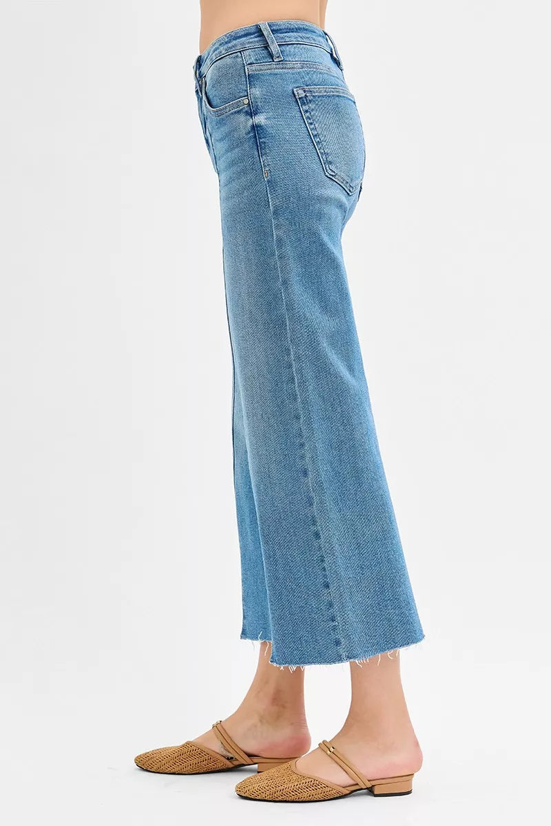 Close up of front slit and raw hem on RISEN jeans
