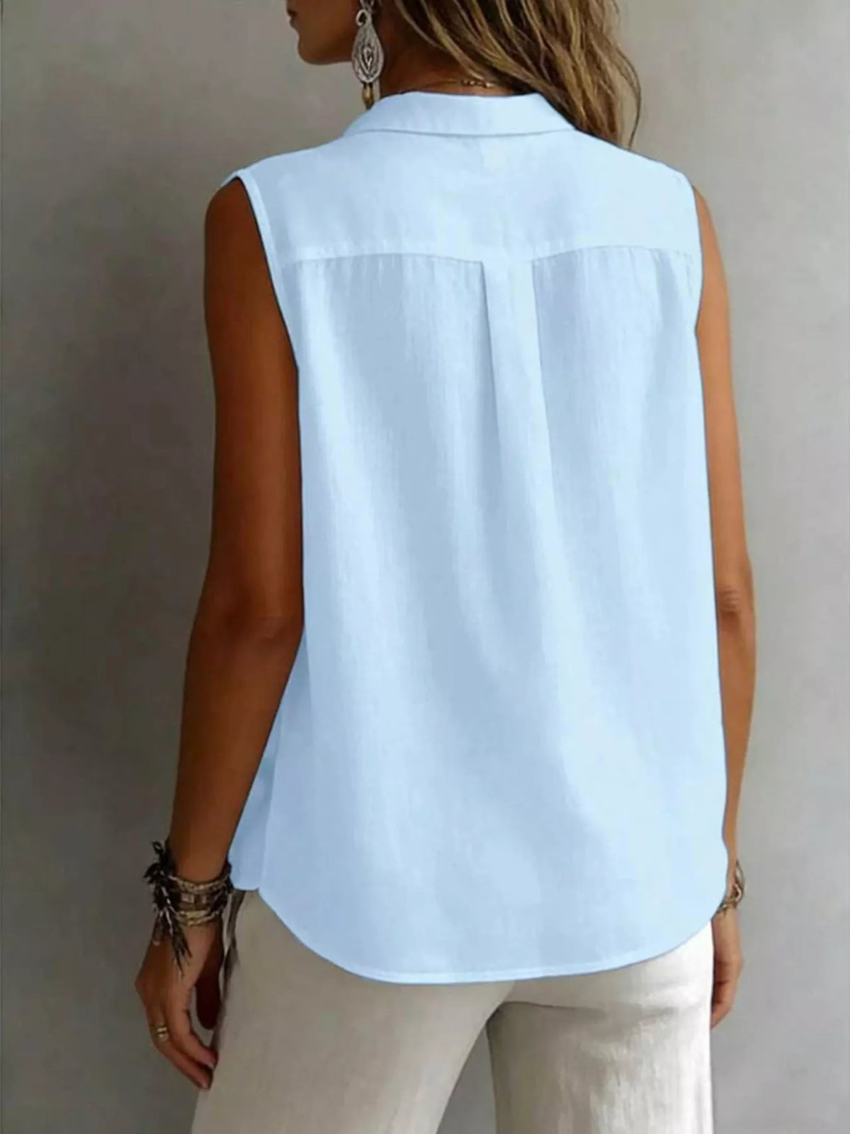 Sleeveless collared button down shirt styled view