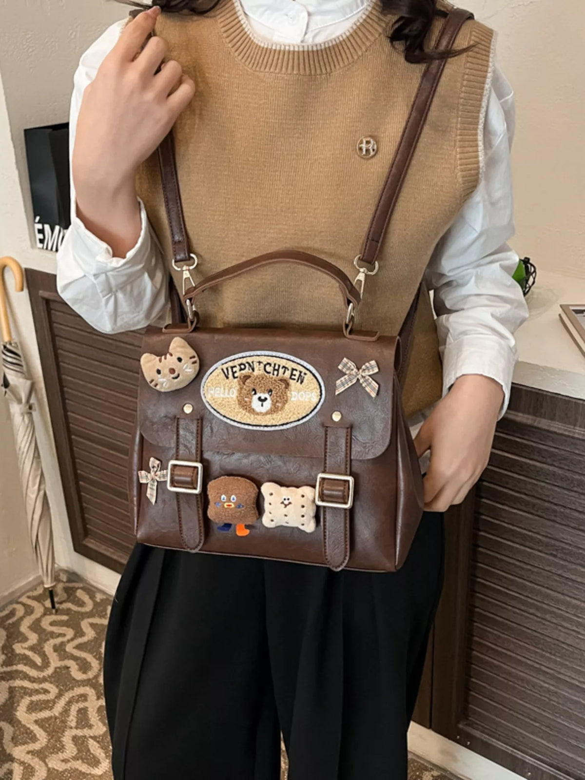 Bear decor mini backpack worn on shoulder