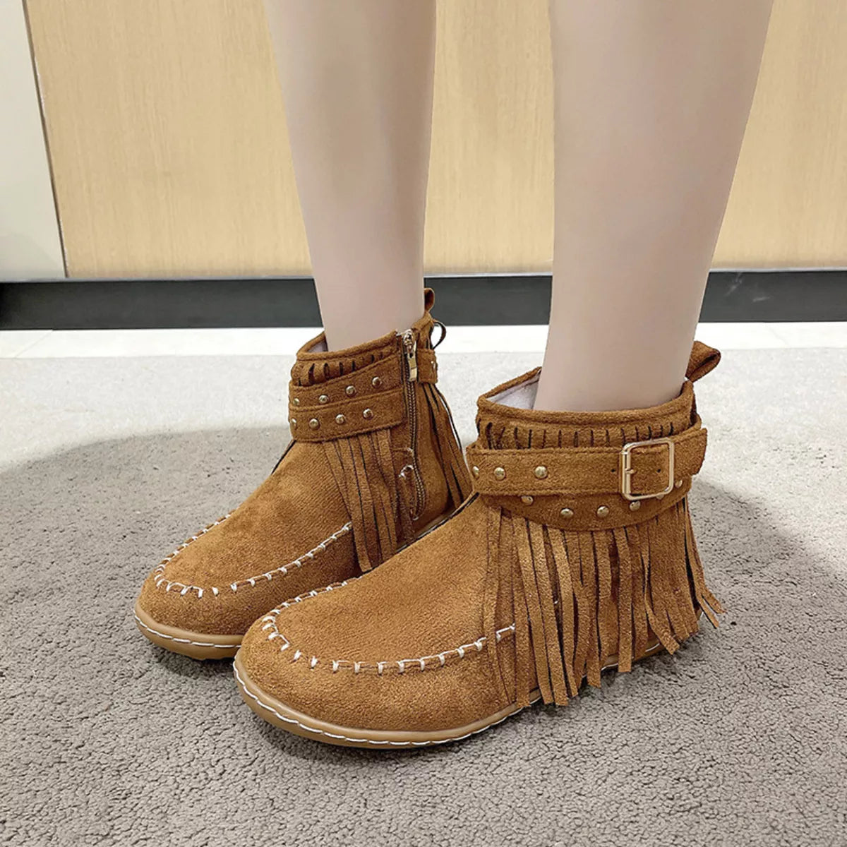 Fringe round toe boots heel detail
