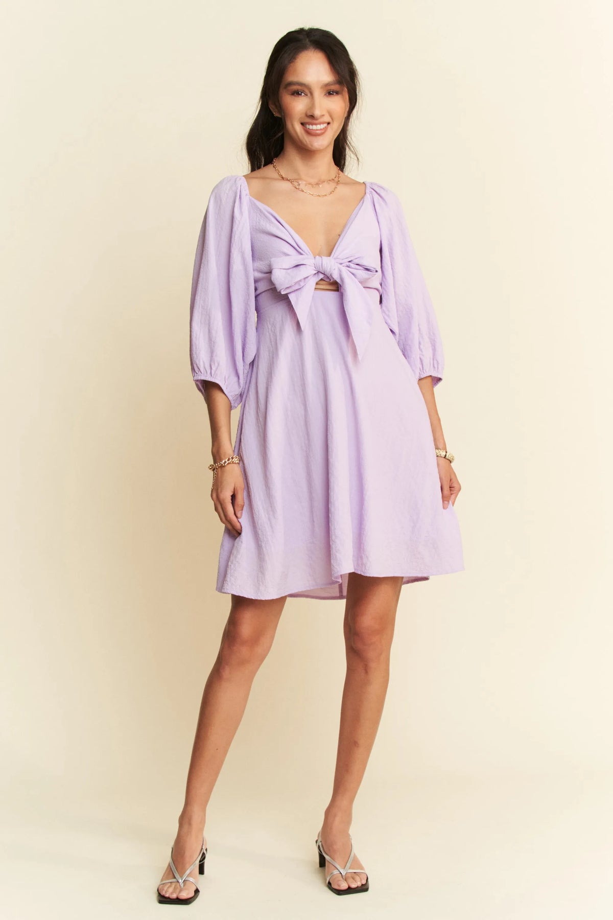 Self Tie Puff Sleeve Smocking Open Back Mini Dress on model