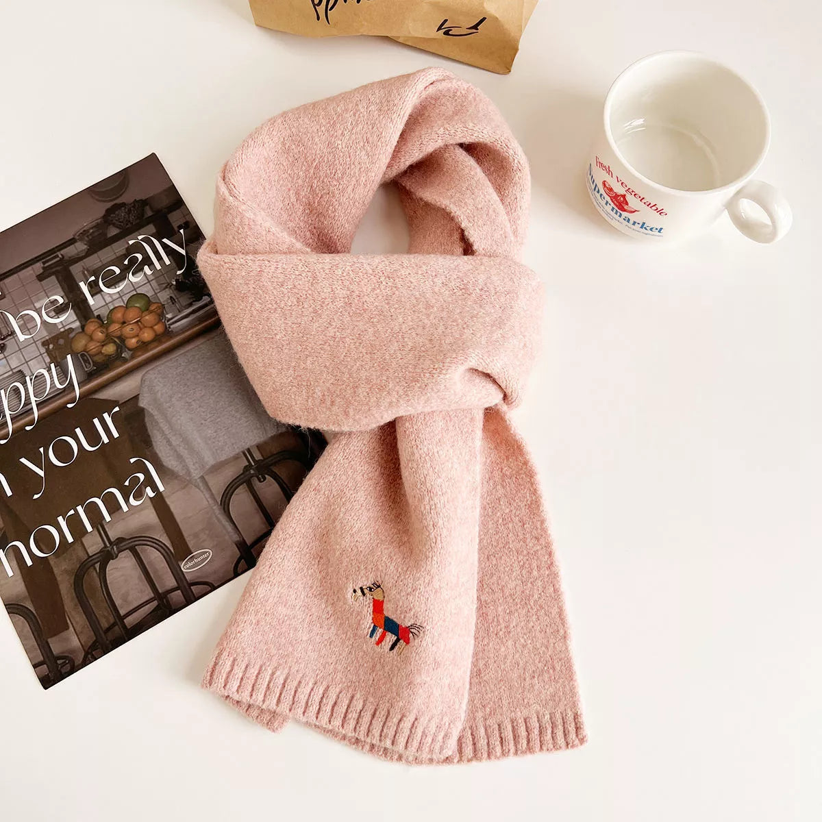 Embroidered wool scarf styled with a winter coat